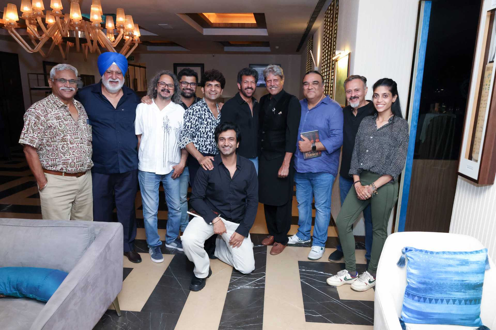 Members posing together with Kapil Dev at a private Club evening