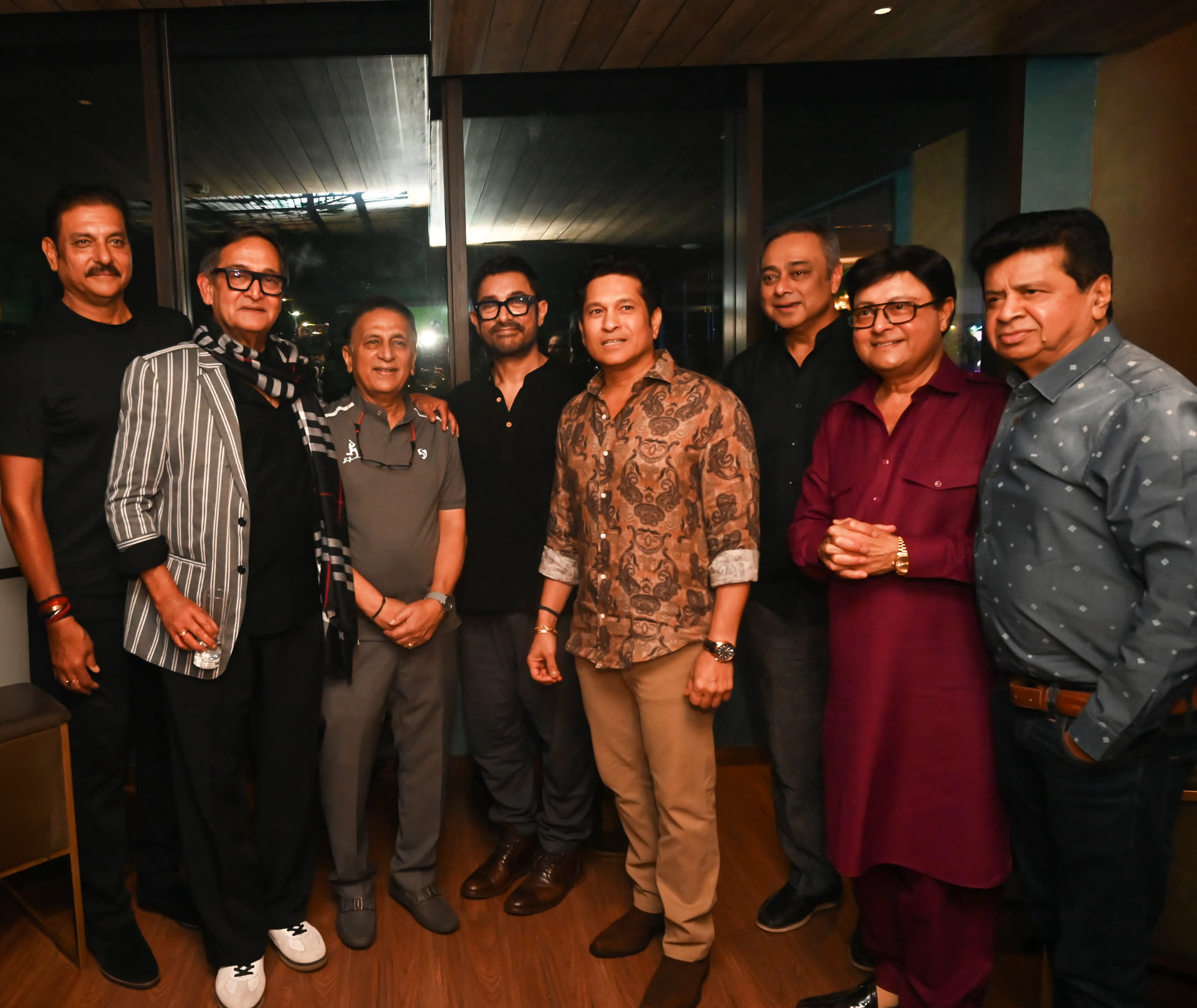 Members with cricket and film icons at a private Club evening